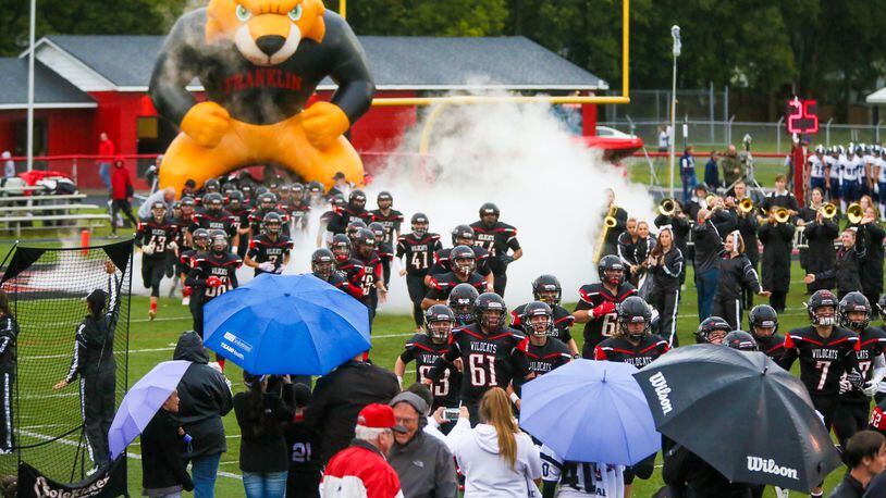 Franklin players take the field for their game against Edgewood at Atrium Stadium in Franklin on Sept. 1. The host Wildcats posted a 49-21 victory. GREG LYNCH/STAFF