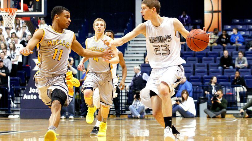 Lakota East’s Dylan Lowry (23) advances the ball down the court during a Division I sectional game against Moeller on Feb. 28, 2014, at Xavier University’s Cintas Center. JOURNAL-NEWS FILE PHOTO