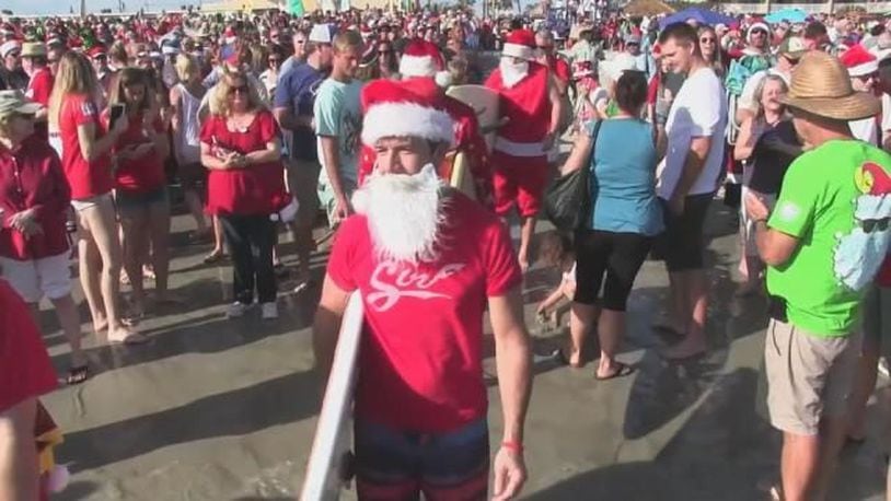 More than 837 Santa-suit wearing surfers caught waves off Cocoa Beach, Florida. (Photo: WFTV.com)