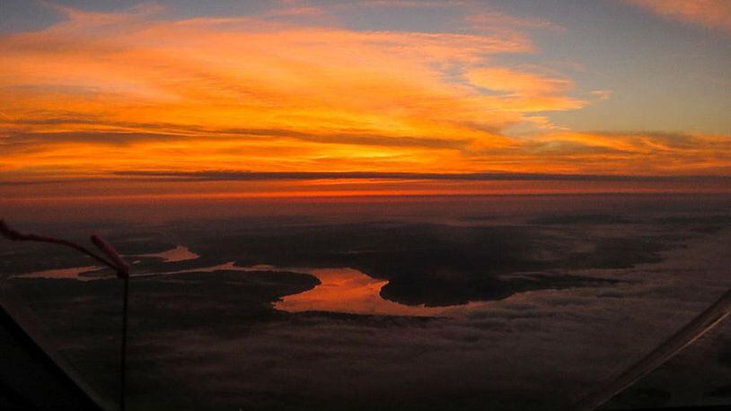 An aerial view of the Mississippi River at sunset. A Georgia student's body was found in the river Sunday after he fell in Friday night. Strong currents swept him away.