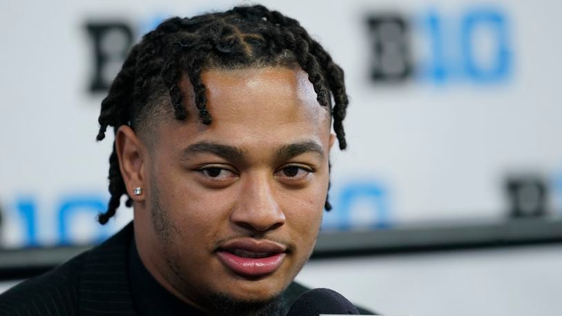 Ohio State wide receiver Jaxon Smith-Njigba talks to reporters during an NCAA college football news conference at the Big Ten Conference media days at Lucas Oil Stadium, Wednesday, July 27, 2022, in Indianapolis. (AP Photo/Darron Cummings)