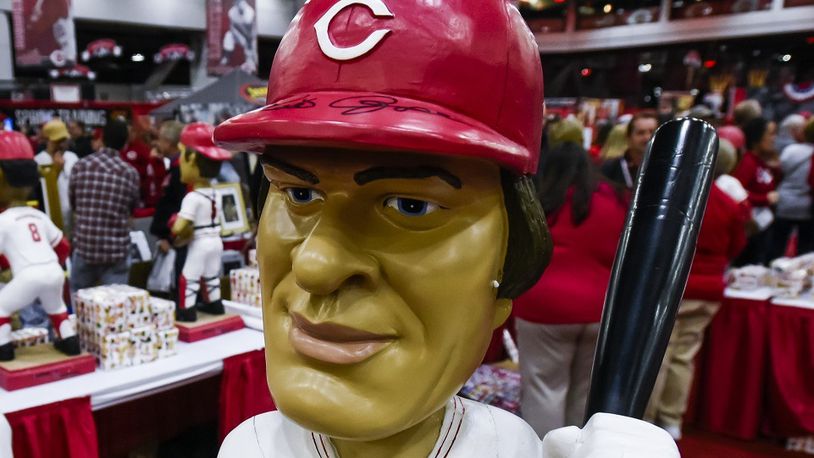 The bobblehead booth was decorated with oversized bobbleheads of former Reds players, like this one of Pete Rose, during RedsFest Friday, Dec 2 at Duke Energy Convention Center in Cincinnati. NICK GRAHAM/STAFF
