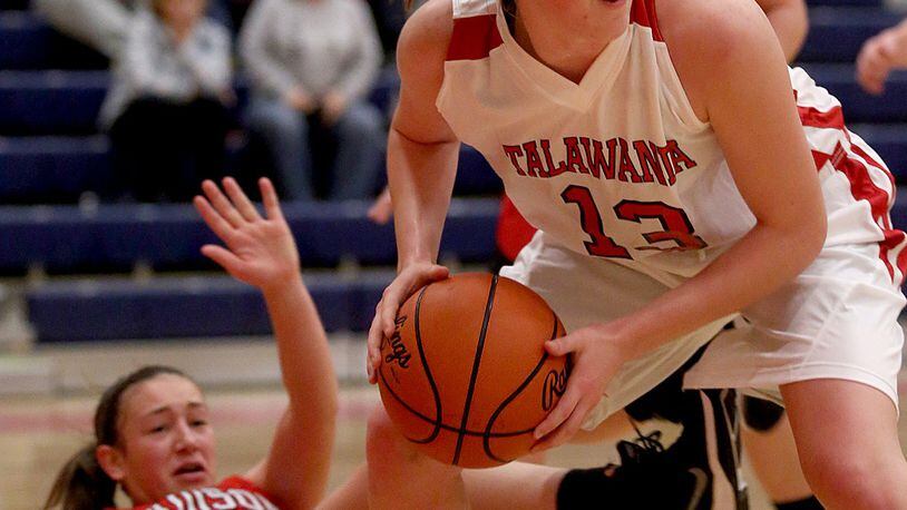 Madison guard Hunter Whiteman hits the floor as Talawanda guard Emma Wright looks for a teammate on Dec. 14, 2015, in Oxford. CONTRIBUTED PHOTO BY E.L. HUBBARD
