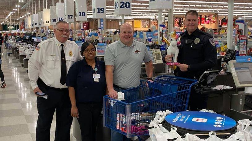 Fairfield Twp. fire and police officials, along with other hometown heroes around Fairfield Twp. and the city of Fairfield, shopped for dozens of children around the two communities for Dougie & Ray's annual Shop with a Hero program. PROVIDED