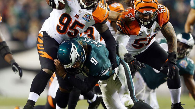 PHILADELPHIA, PA - DECEMBER 13: Wallace Gilberry #95 of the Cincinnati Bengals recovers a fumble by Nick Foles #9 of the Philadelphia Eagles and runs it in for a touchdown on December 13, 2012 at Lincoln Financial Field in Philadelphia, Pennsylvania. (Photo by Elsa/Getty Images)