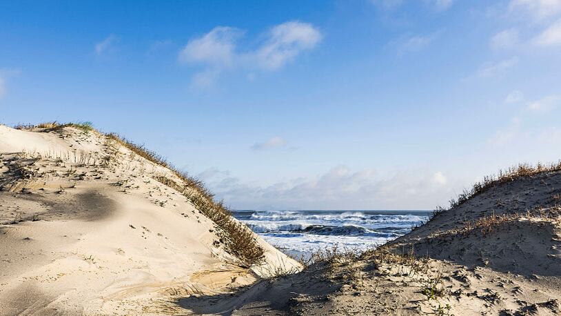 Dunes and ocean at Cape Hatteras National Seashore. (Photo by John Greim/LightRocket via Getty Images)